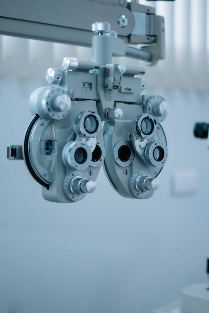 Detailed view of a phoropter used in eye exams at an optometry clinic, emphasizing precision and technology.